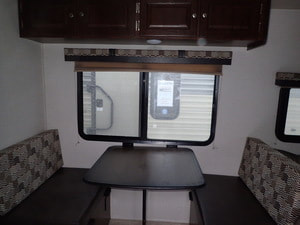 Dinette area in 2018 Palomino Bunkhouse trailer for rent near Lansing